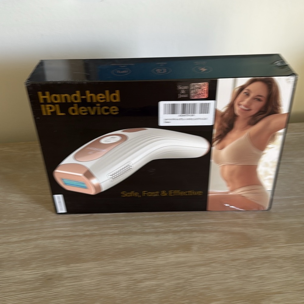 Hand-held IPL hair removal Device in White and Gold